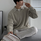Men's ribbed quarter-zip sweater with collared neckline and long sleeves