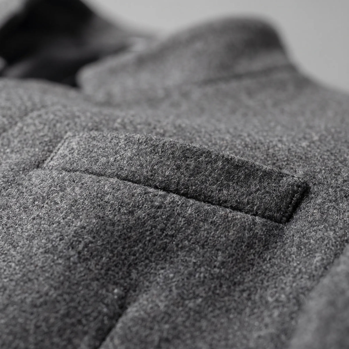 Men's tailored top coat with stand collar and button front