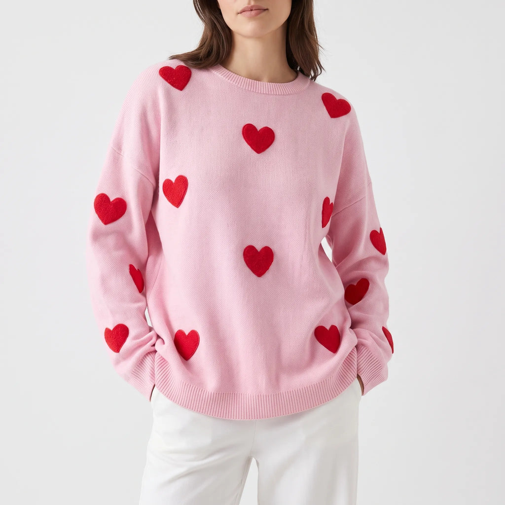 Women's oversized knitted jumper with raised red heart motifs and long sleeves