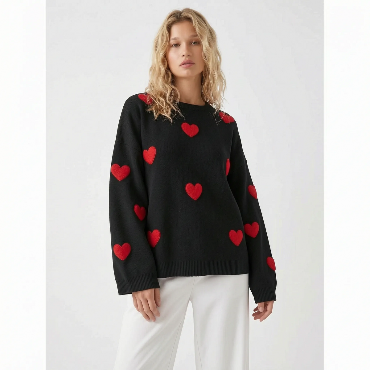 Women's oversized knitted jumper with raised red heart motifs and long sleeves