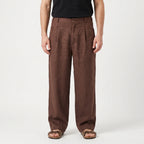 Men's brown wide leg trousers with pleated front and full-length legs
