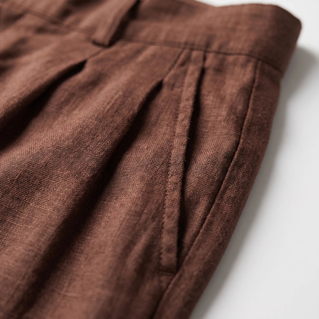 Men's brown wide leg trousers with pleated front and full-length legs