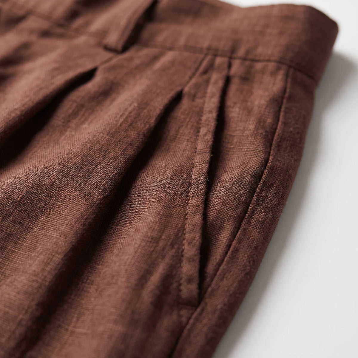 Men's brown wide leg trousers with pleated front and full-length legs