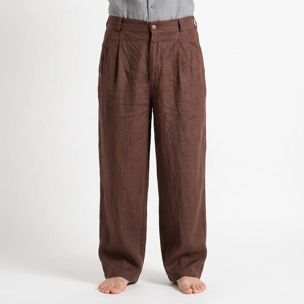 Men's brown wide leg trousers with pleated front and full-length legs