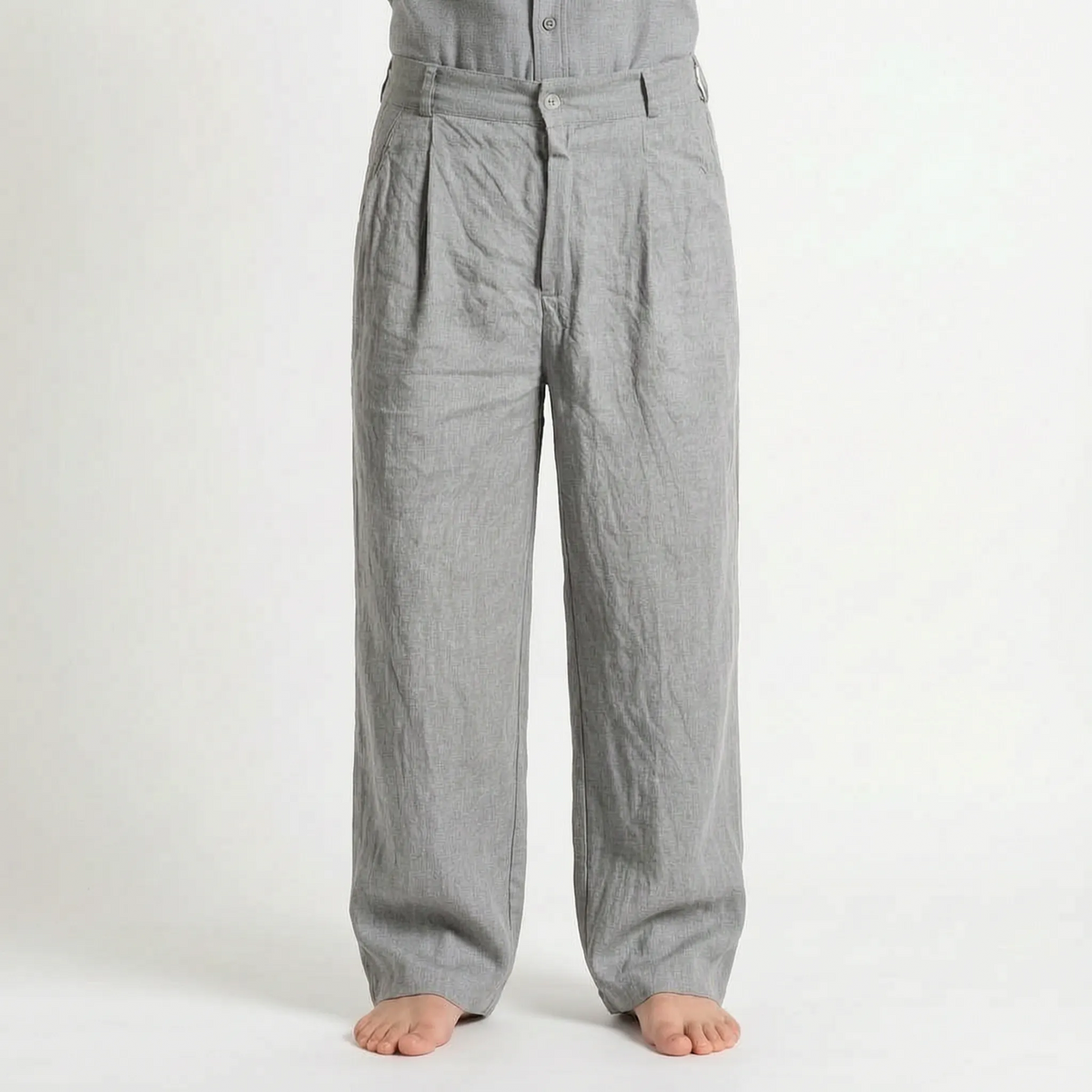 Men's brown wide leg trousers with pleated front and full-length legs