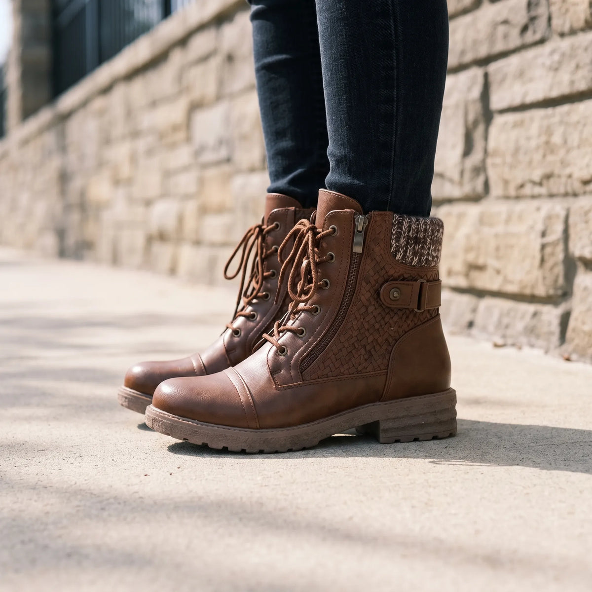 Women's lace-up combat boots with knitted ankle collars and textured side panels