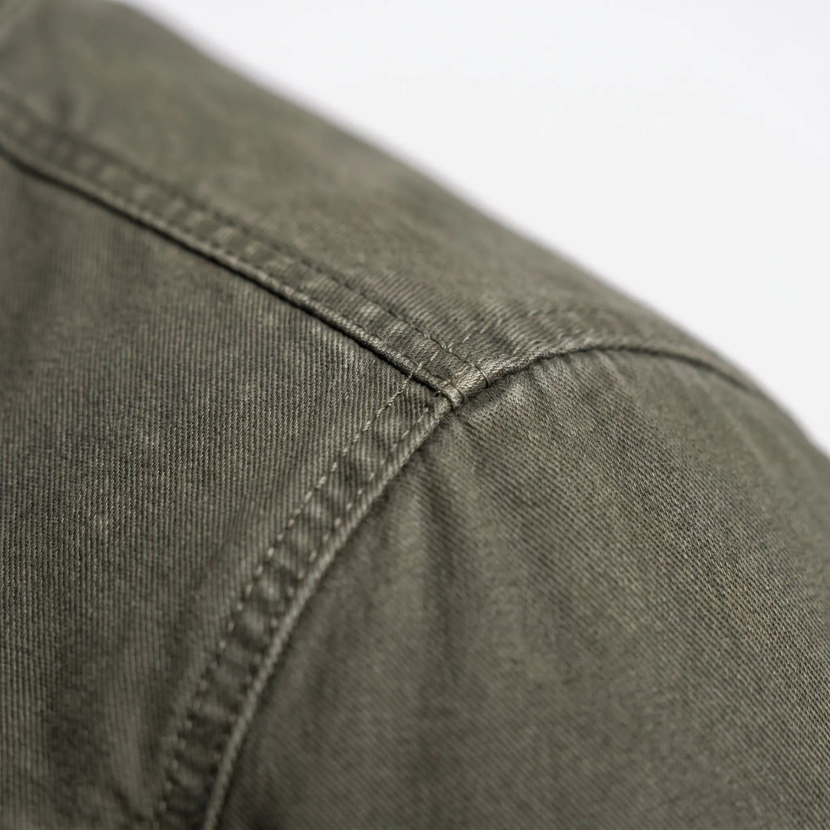 Men's olive green zip-up jacket with stand collar and utility pockets