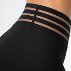 Women's black wide-leg trousers with high waist and cross-over mesh waistband