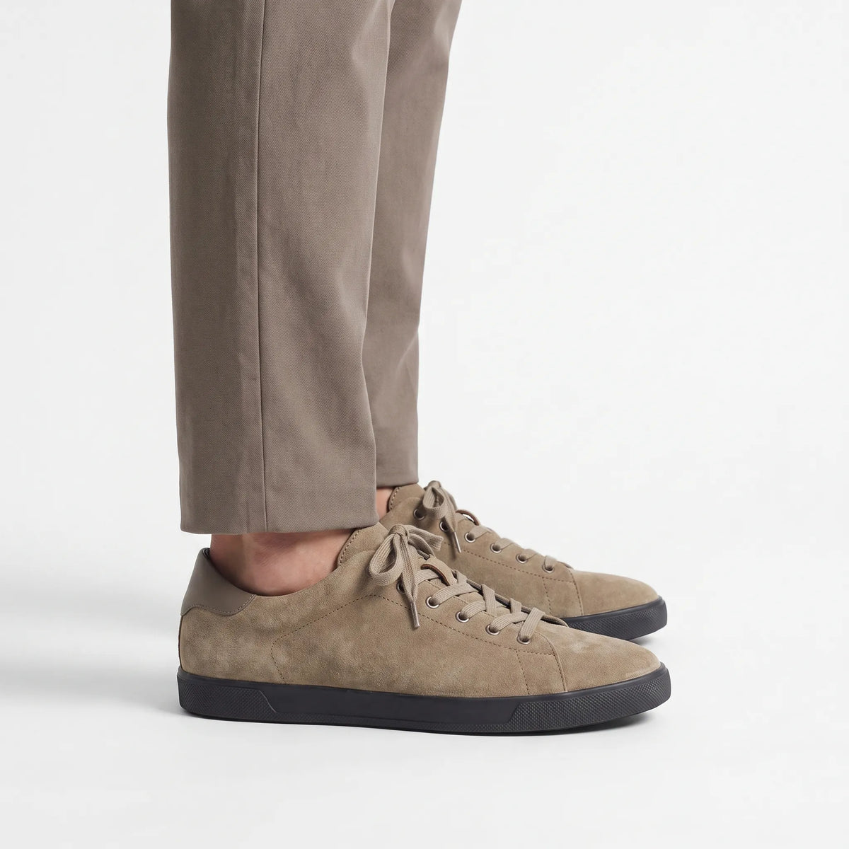 Men's low-top lace-up trainers with textured uppers and flat dark soles