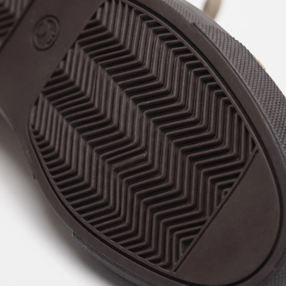 Men's low-top lace-up trainers with textured uppers and flat dark soles