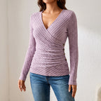 Women's ribbed wrap-front top with long sleeves, V-neckline and side buttons