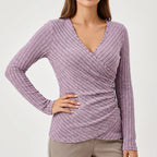 Women's ribbed wrap-front top with long sleeves, V-neckline and side buttons
