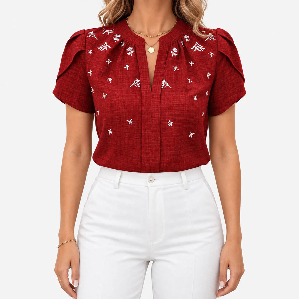 Women's short sleeve blouse with white botanical print and V-neckline