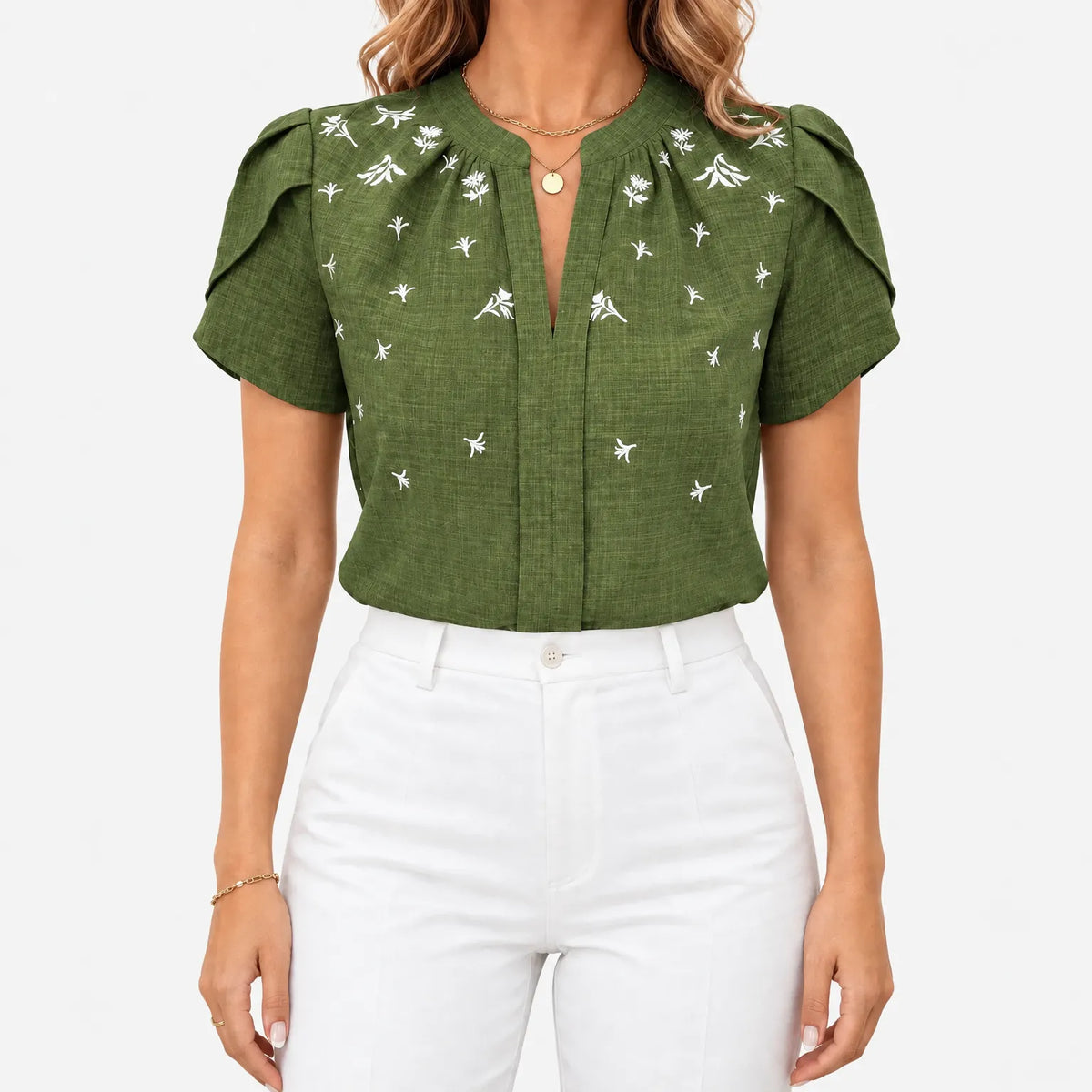 Women's short sleeve blouse with white botanical print and V-neckline