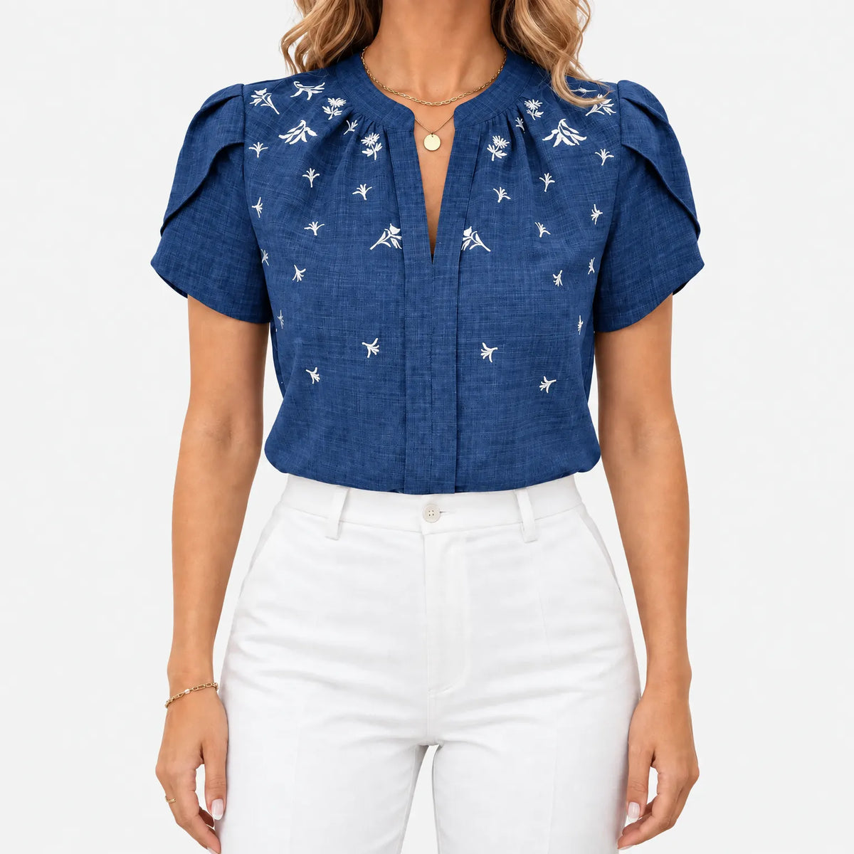 Women's short sleeve blouse with white botanical print and V-neckline