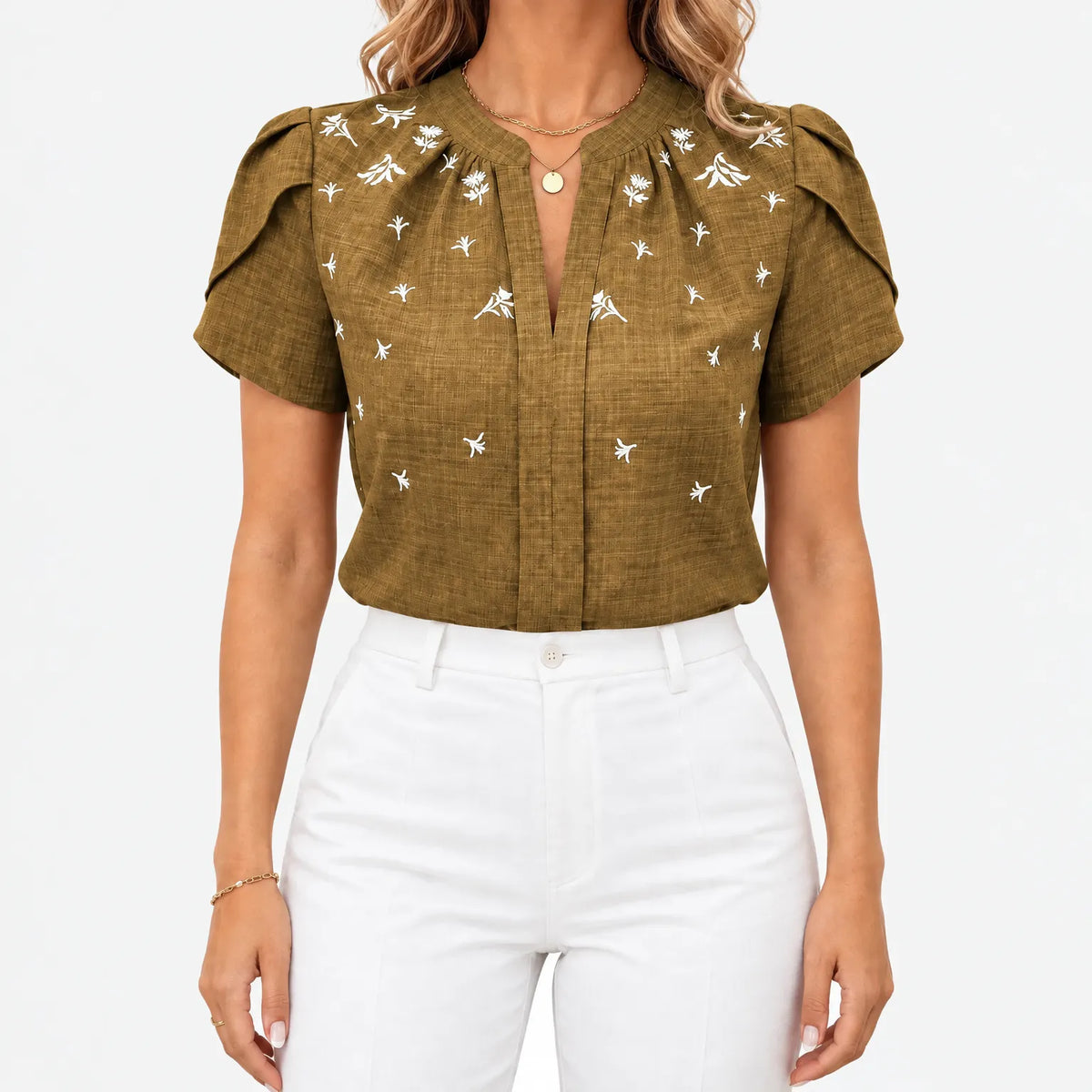 Women's short sleeve blouse with white botanical print and V-neckline
