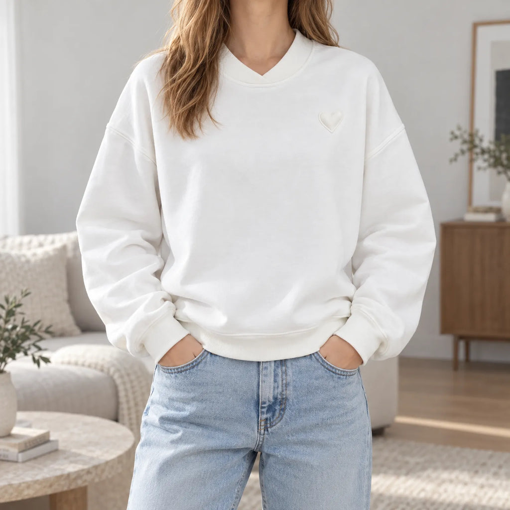 Women's oversized crew neck sweatshirt with long sleeves and small heart detail
