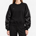 Women's oversized crew neck sweatshirt with long sleeves and small heart detail