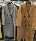 Women's long tailored coat with notched lapels and button front