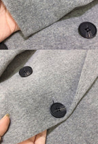 Women's long tailored coat with notched lapels and button front