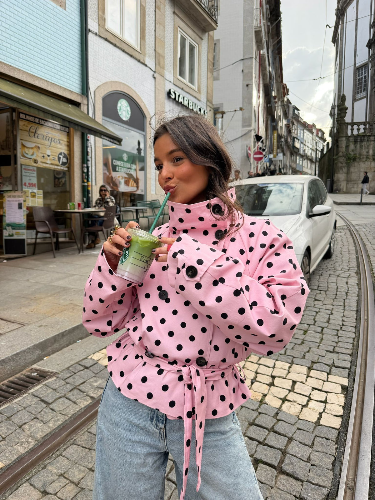 Women's pink cropped jacket with black polka dots, high collar and tie waist