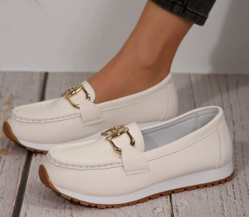 Women's flat slip-on loafers with buckle trims and moc-toe stitching