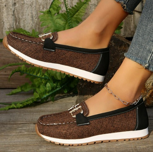 Women's flat slip-on loafers with buckle trims and moc-toe stitching