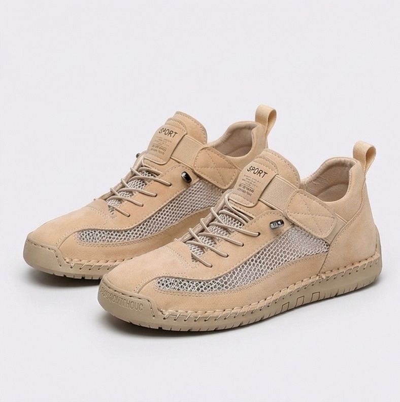 Women's lace-up trainers with mesh side panels, rounded toe and flat textured sole