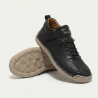 Unisex high-top trainers with laces, elastic side straps and textured flat soles