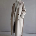 Women's long trench coat with notched lapels, buttons and side pockets