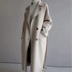 Women's long trench coat with notched lapels, buttons and side pockets