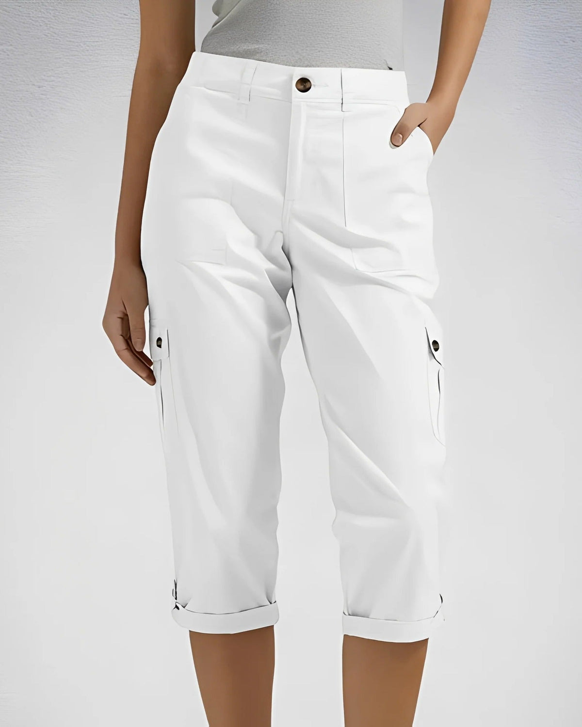 Women's cropped cargo trousers with rolled cuffs and multiple utility pockets