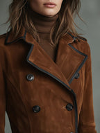 Women's brown double-breasted long coat with black trim and belt