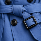 Women's belted double-breasted trench coat with long sleeves and checked lining