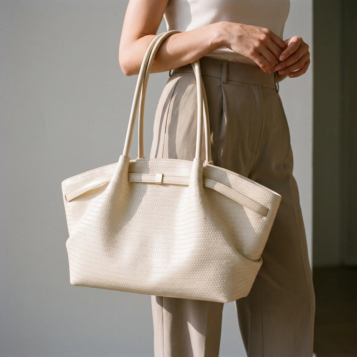 Women's textured woven trapeze tote handbag with long shoulder handles