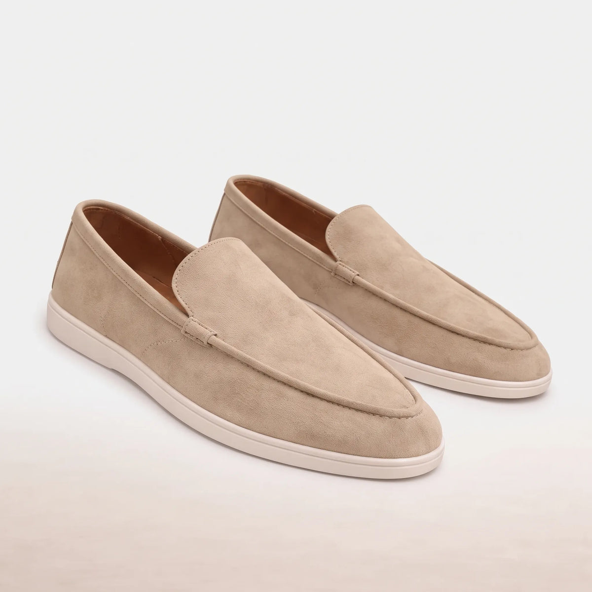 Men's slip-on loafers with rounded moc toes, stitched edging and flat soles