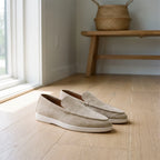 Men's slip-on loafers with rounded moc toes, stitched edging and flat soles