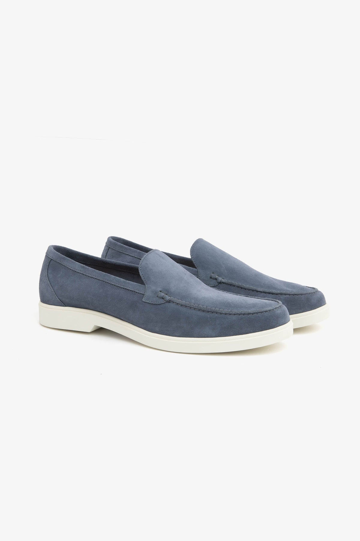 Men's blue moccasin loafers with stitched detailing and light flat soles