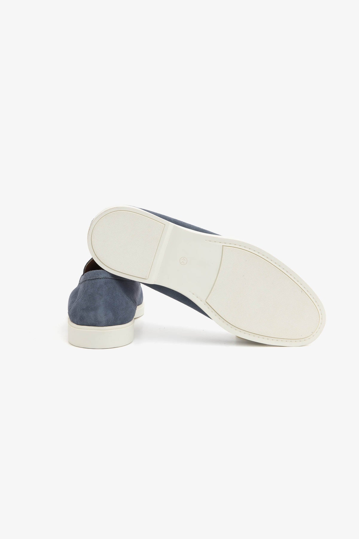 Men's blue moccasin loafers with stitched detailing and light flat soles