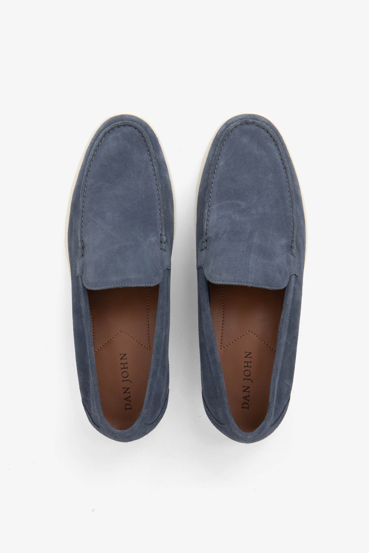 Men's blue moccasin loafers with stitched detailing and light flat soles