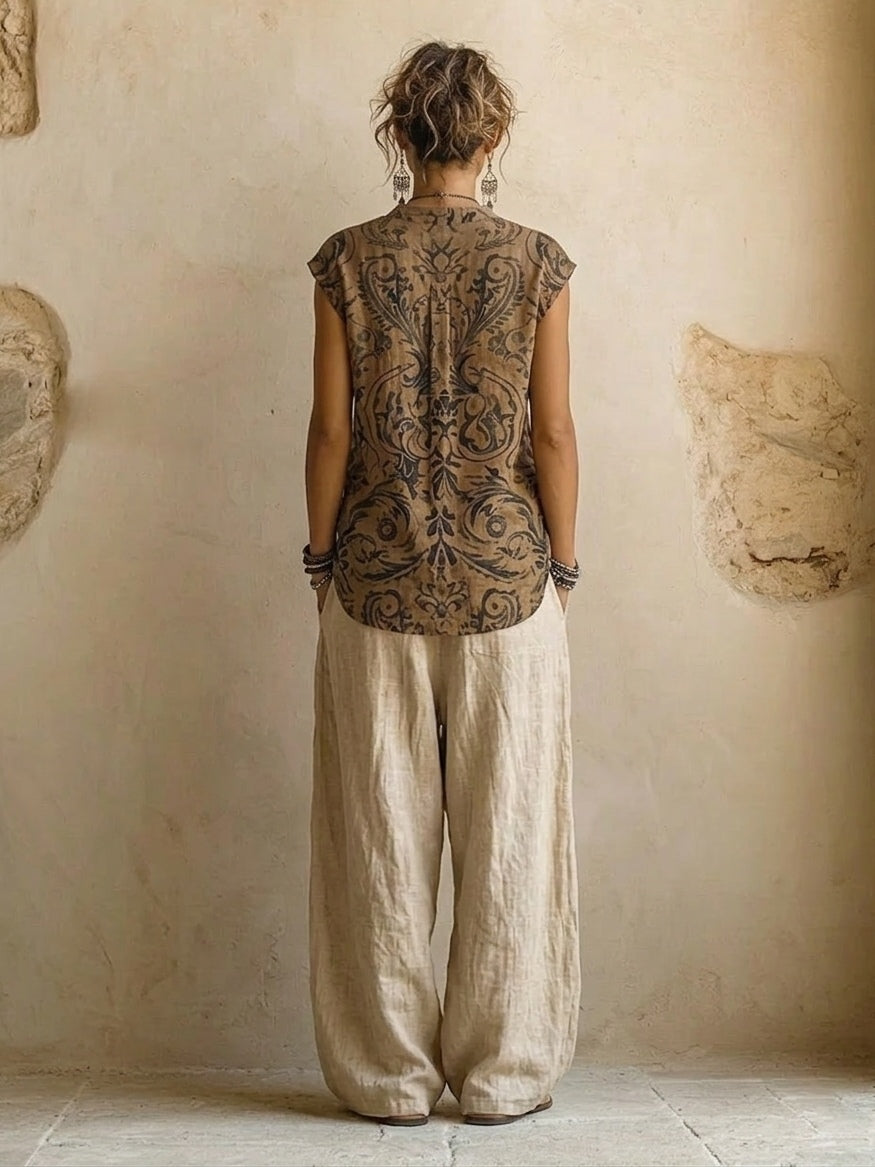 Women's beige three-piece outfit with printed sleeveless top, long cardigan and wide trousers