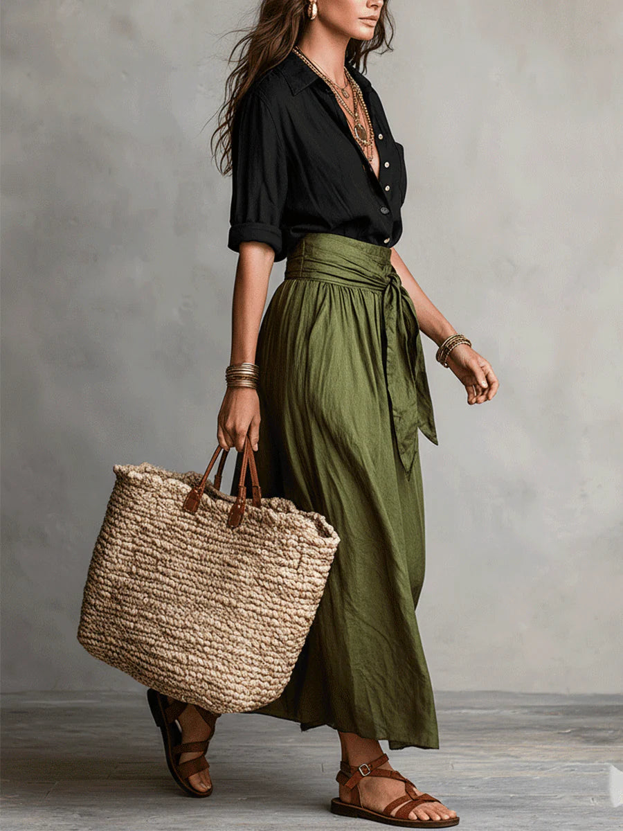 Women's black collared shirt and olive green high-waisted midi skirt set