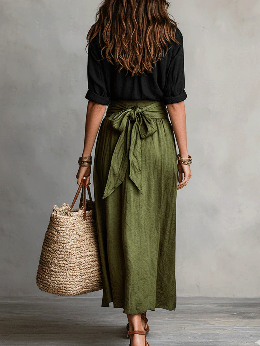 Women's black collared shirt and olive green high-waisted midi skirt set