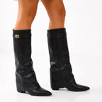Black women's pointed toe knee high boots with buckle detail and low heels