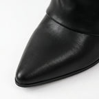 Black women's pointed toe knee high boots with buckle detail and low heels