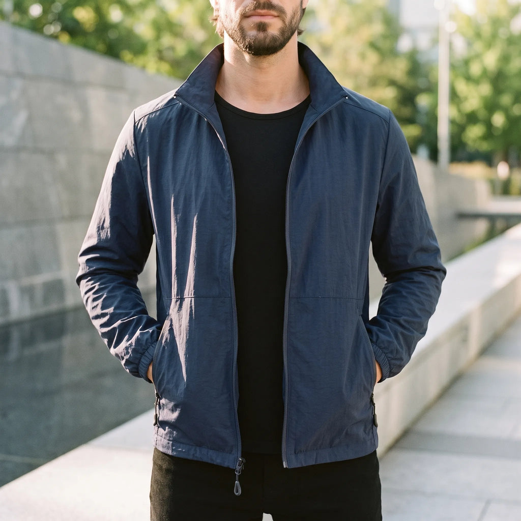 Men's lightweight zip-up windbreaker jacket with stand collar and zipped pockets