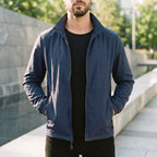 Men's lightweight zip-up windbreaker jacket with stand collar and zipped pockets