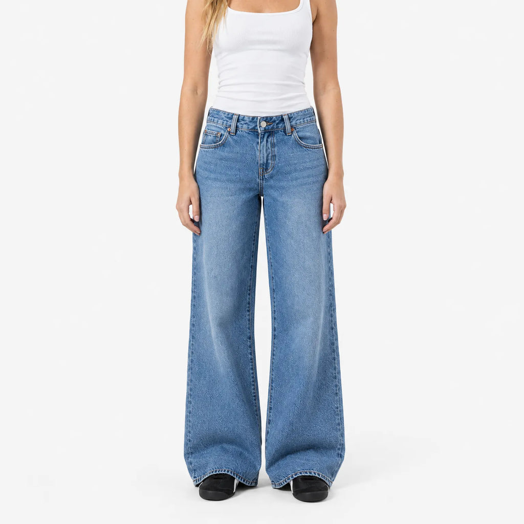 Women's blue low-rise baggy wide-leg jeans with faded finish