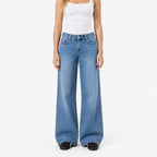 Women's blue low-rise baggy wide-leg jeans with faded finish