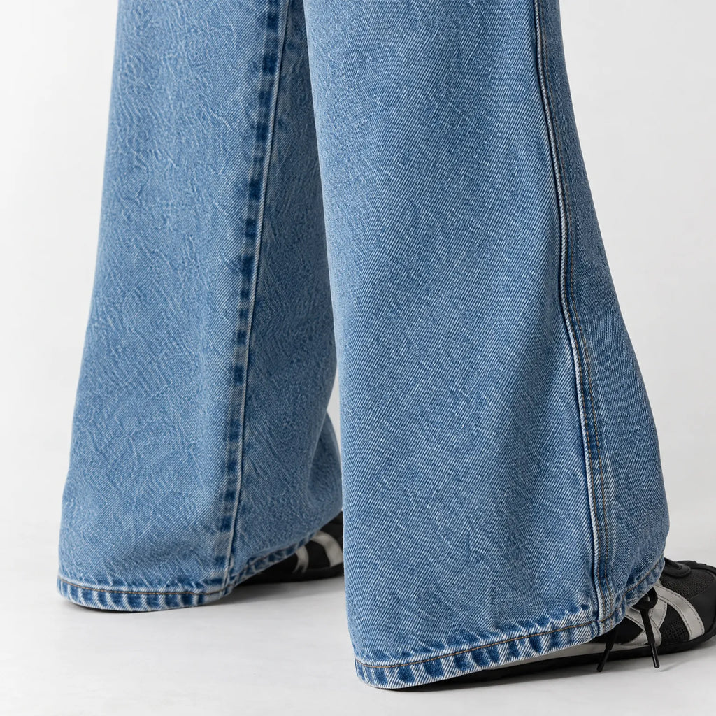 Women's blue low-rise baggy wide-leg jeans with faded finish